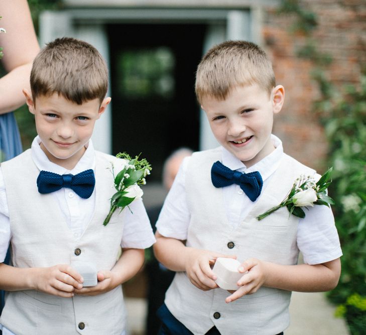 Page Boys in Beige Waistcoats with Black Bow ties