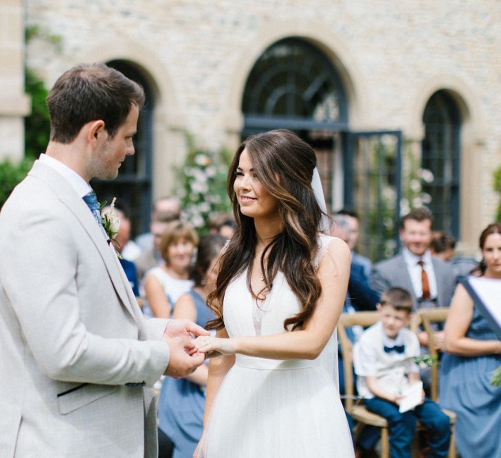 Bride and Groom Exchange Vows at Outdoor Wedding Ceremony at Middleton Lodge