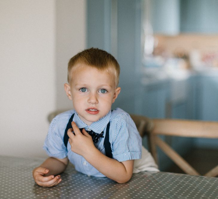 Page Boy in Stripe Shirt, braces and bow tie on wedding morning