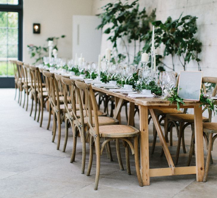 Long wooden wedding breakfast table at The Fig House, Middleton Lodge with Acrylic Wedding Signs