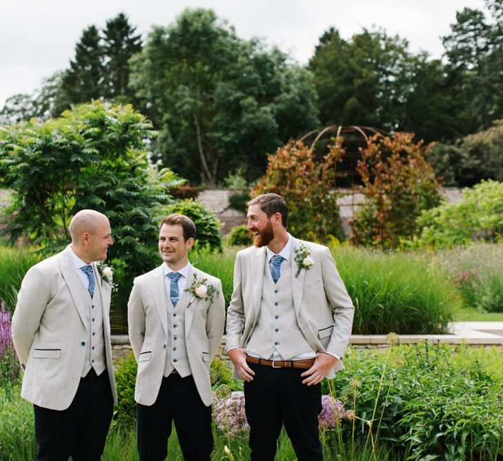 Groomsmen in Black Trousers and Beige Blazers with Blue Ties