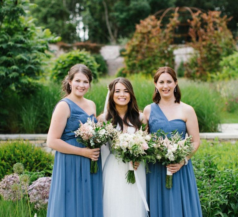 Bridal Party Portrait with Bridesmaids in Once Shoulder Blue Dresses