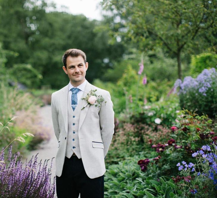 Groom in Black Trousers and Beige Waistcoat and Blazer