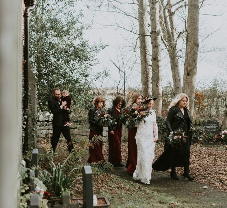 Bridal Party Portrait with Bride in Phase Eight Wedding Dress and Bridesmaids in Deep Red Dresses and Leather Jackets from ASOS