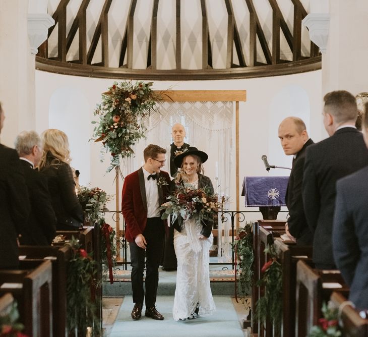 Stylish Bride and Groom Walking Up the Aisle as Husband and Wife