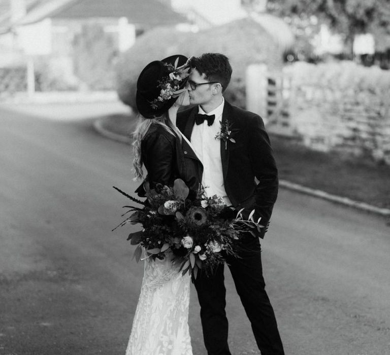 Black and White Portrait of Bride and Groom Kissing