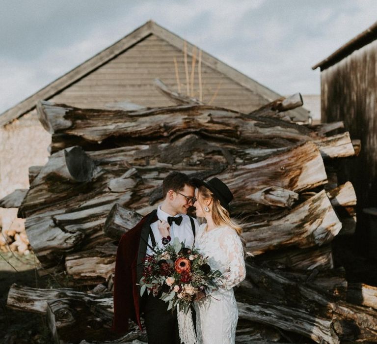 Stylish Bride in Phase Eight High Street Wedding Dress and Groom in Tuxedo and Bow Tie