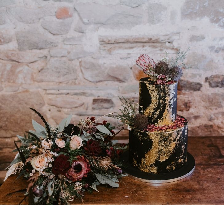 Black Two Tier Wedding Cake with Gold Details