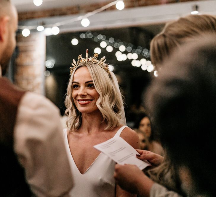 Bride in gold bridal crown with jewels by Howling Moon