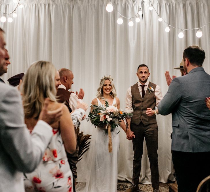 Bride and groom standing at the altar