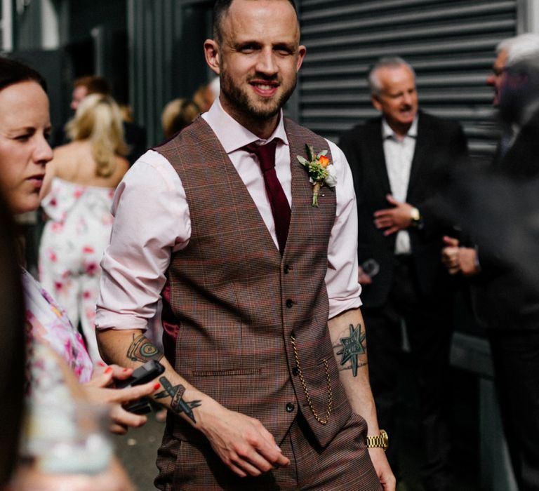 Groom in brown check waistcoat