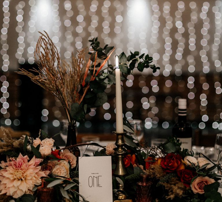 Wedding table decor with flowers and taper candles