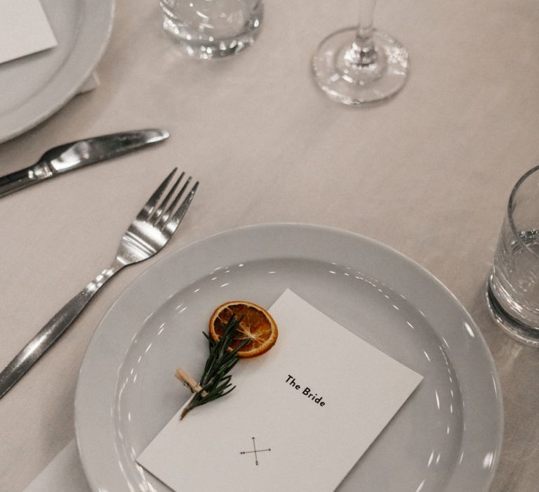 Minimalist place setting with orange slice