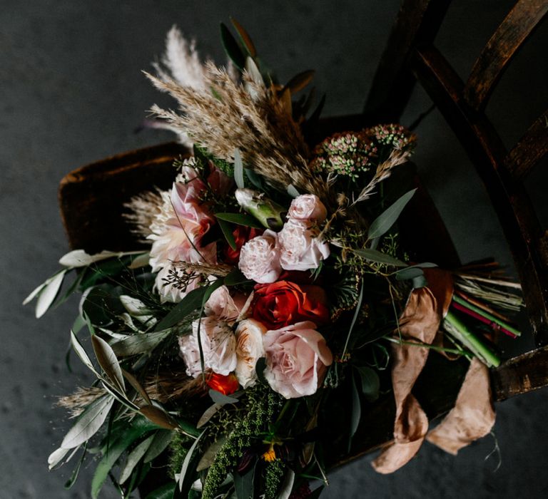 Bridal bouquet with foliage, roses, dahlias and dried grasses