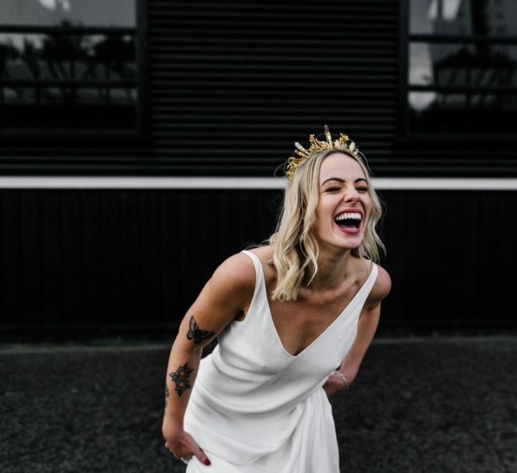 Happy bride in Charlie Brear wedding dress with gold bridal crown