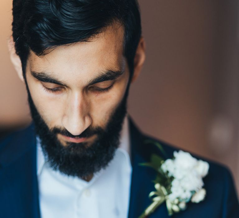 Bearded Groom in Navy Suit with White Flower Buttonhole