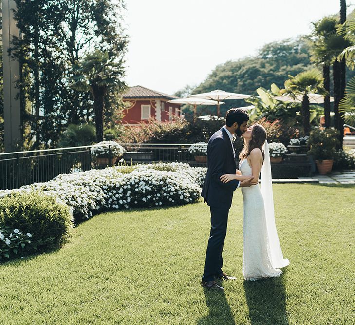 First Look with Bride in Grace Loves Lace Mia Wedding Dress and Groom in Taliare Navy Suit