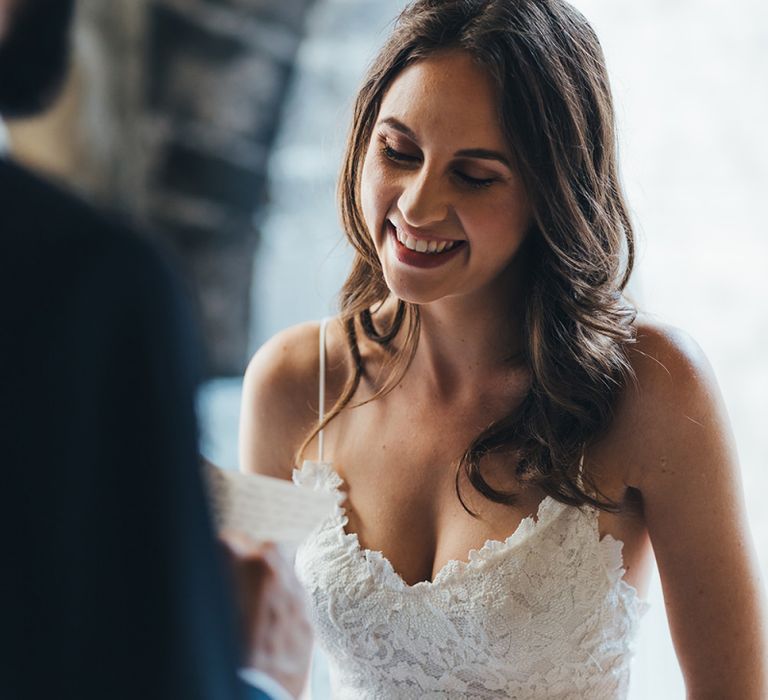 Happy Bride in Grace Loves Lace Mia Wedding Dress Listening to Her Grooms Vows