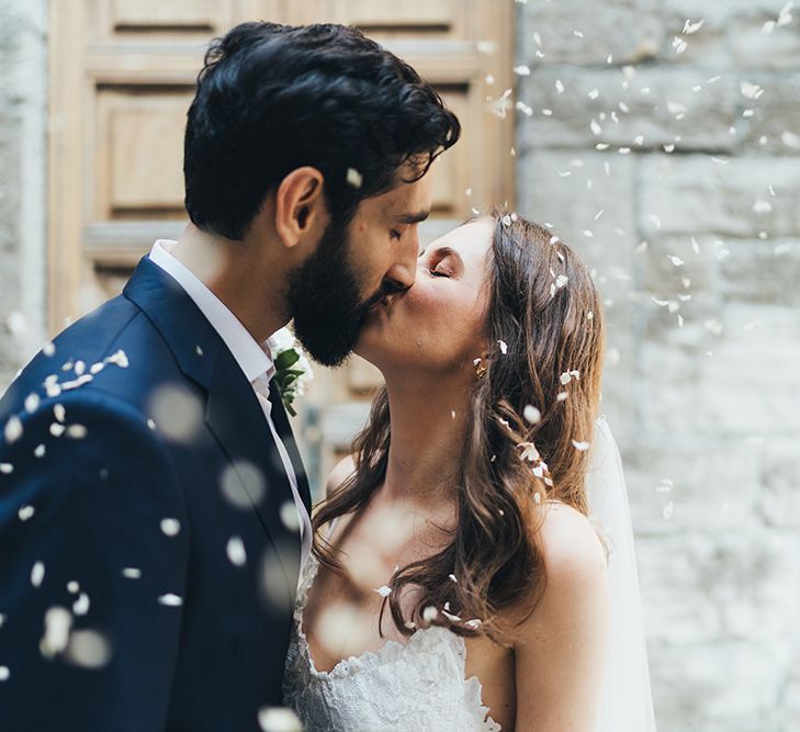 Confetti Moment with Bride in Grace Loves Lace Mia Wedding Dress and Groom in Taliare Navy Suit