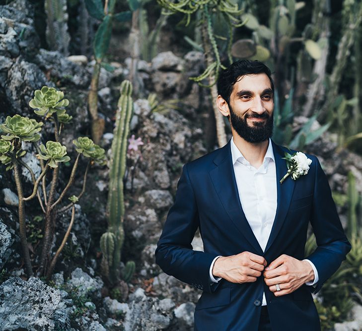 Groom in Taliare Navy Suit and White Shirt