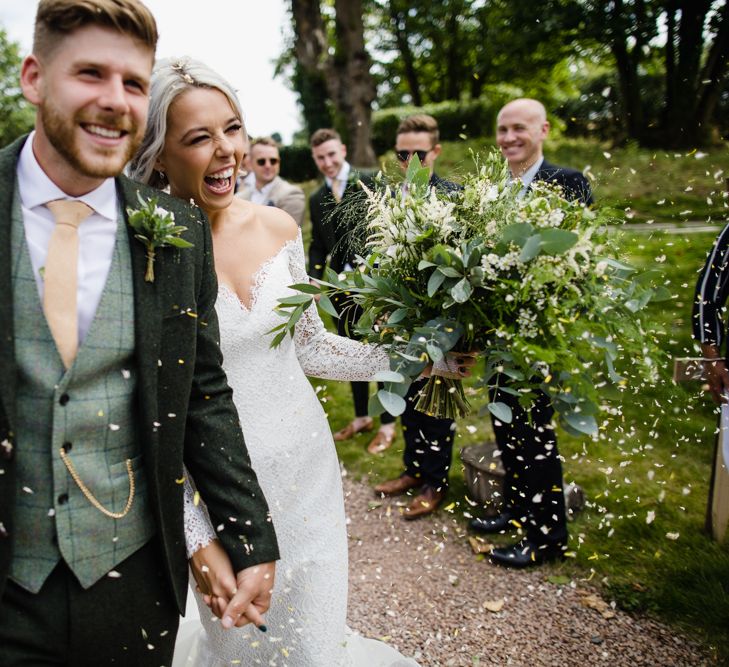 Groom In Green Suit With Waistcoat // Dewsall Court Wedding With Bride In Fishtail Gown 'Adele' By Augusta Jones With Images From Chris Barber Photography And Film From Blooming Lovely Films