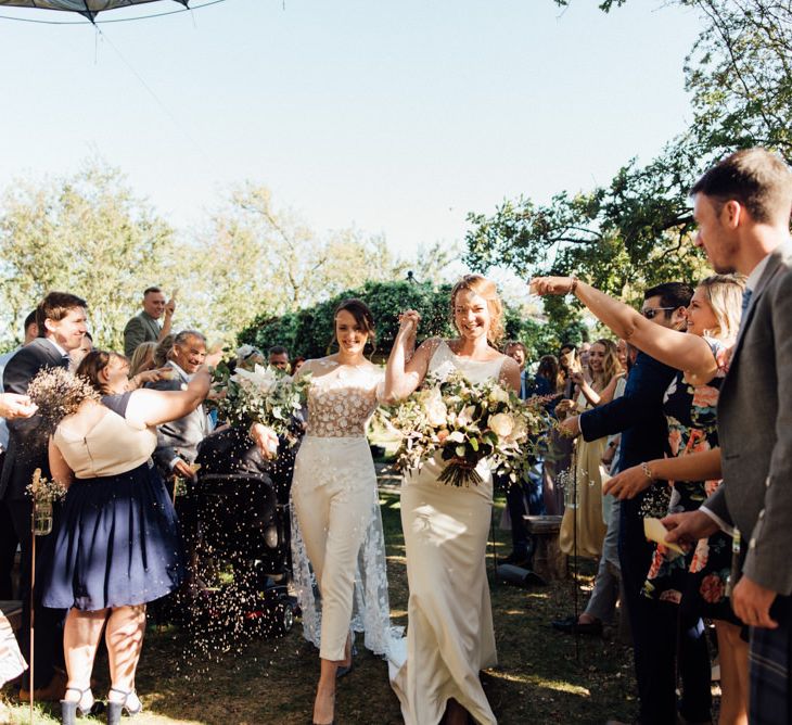 Confetti shot at outdoor wedding ceremony with relaxed decor