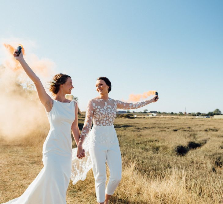 Outdoor celebrations in a field with smoke bombs