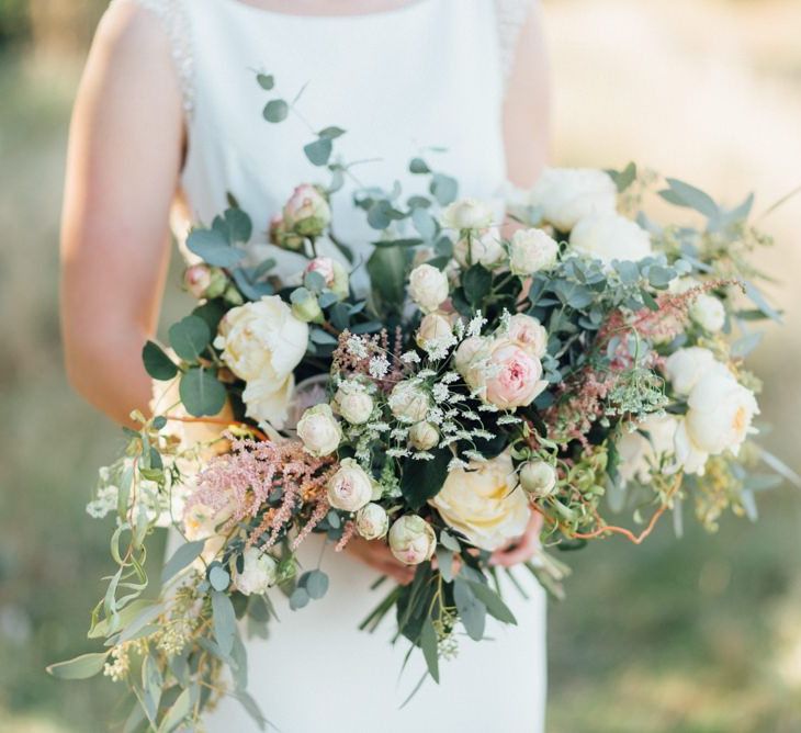 Beautiful white and dusky pink flowers at relaxed woodland celebration in autumn