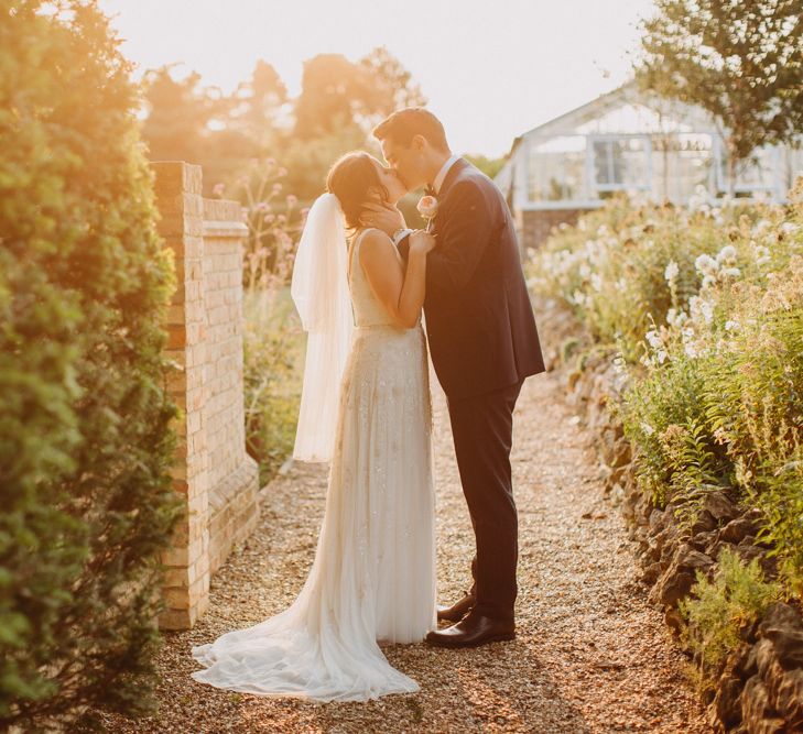 Golden Dusk Couple Shots | Church Wedding Ceremony | Bride in Karen Willis Holmes | Groom in Custom Made Suit by Suit Supply | Summer Wedding at Family Home in Kent | Glass Marquee from Academy Marquees | Frances Sales Photography