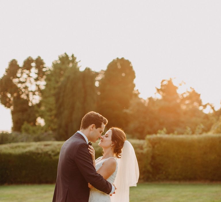 Golden Dusk Couple Shots | Church Wedding Ceremony | Bride in Karen Willis Holmes | Groom in Custom Made Suit by Suit Supply | Summer Wedding at Family Home in Kent | Glass Marquee from Academy Marquees | Frances Sales Photography