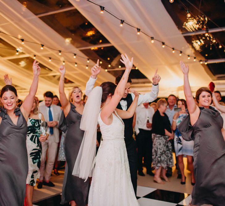 Marquee at Night | Festoon Lights from Stress Free Hire | Flowers from Topiary Tree | Bride in Karen Willis Holmes | Groom in Custom Made Suit by Suit Supply | Summer Wedding at Family Home in Kent | Glass Marquee from Academy Marquees | Frances Sales Photography