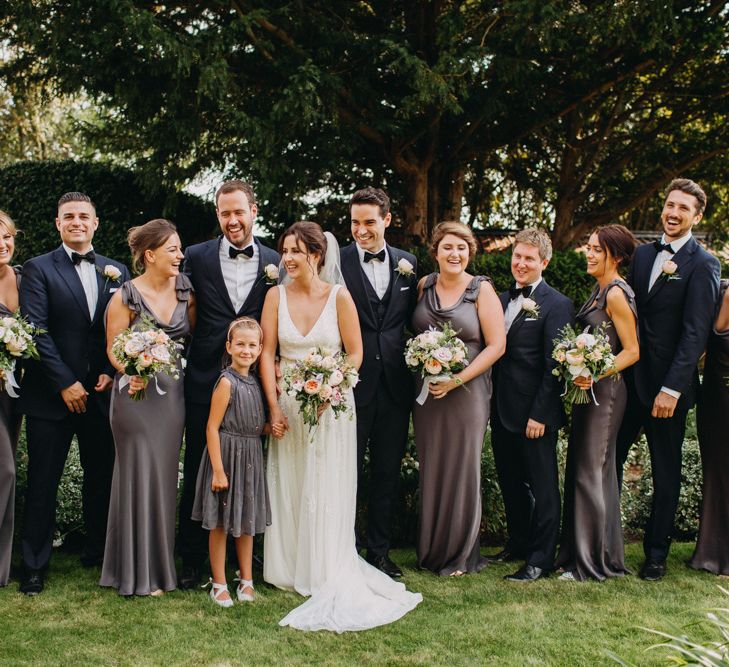 Group Shot | Flowers from Topiary Tree | Bride in Karen Willis Holmes | Groom in Custom Made Suit by Suit Supply | Summer Wedding at Family Home in Kent | Glass Marquee from Academy Marquees | Frances Sales Photography