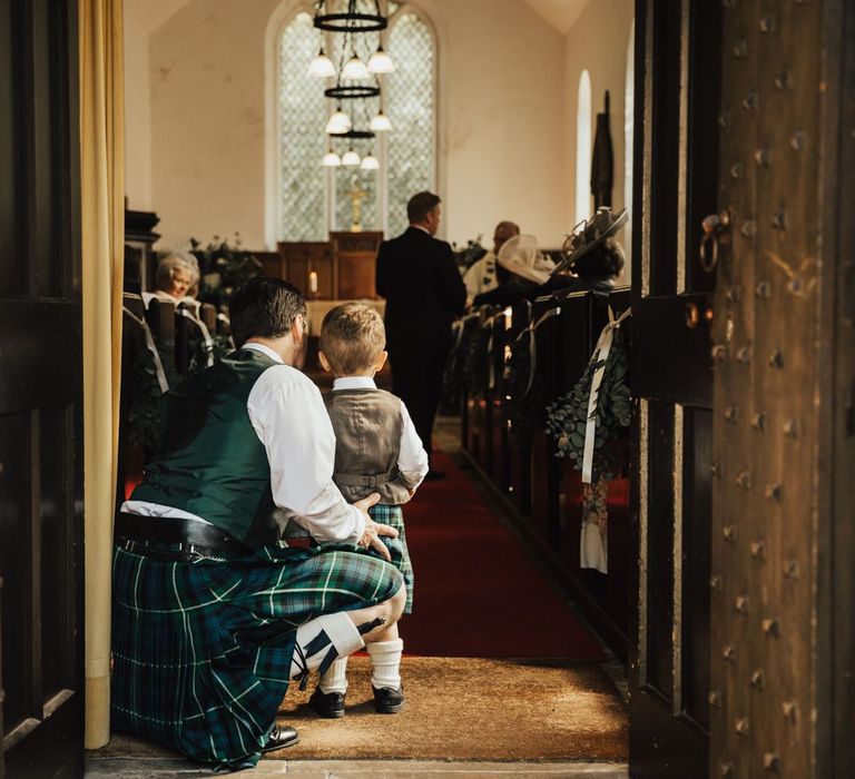 Wedding guests arrive at church ceremony