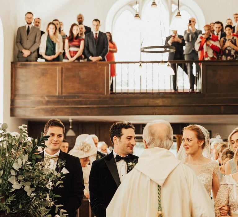 Bride and groom meet at the altar