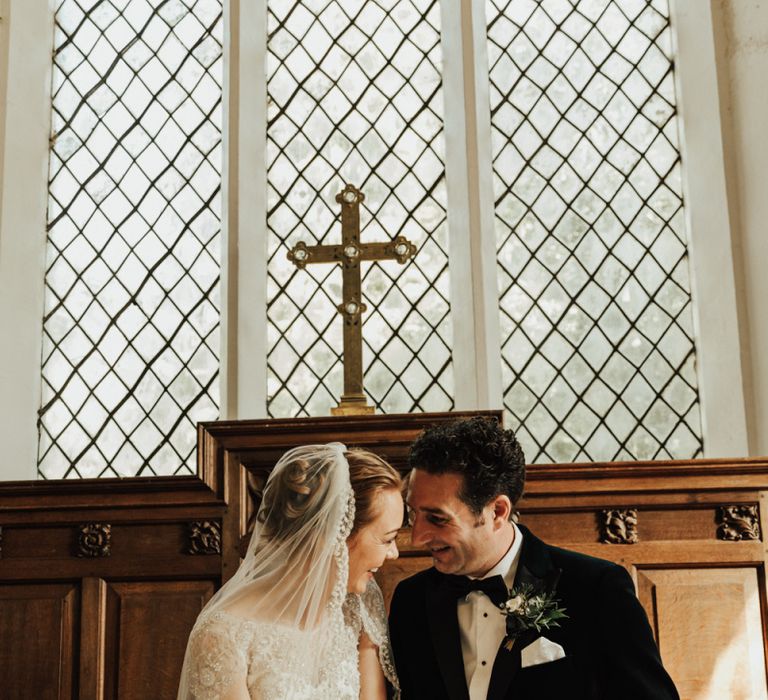 Bride and groom sign the wedding register