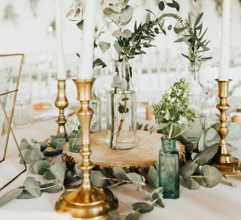 Beautiful wedding decor at Askham Hall wedding  with fairy light canopy candles and foliage