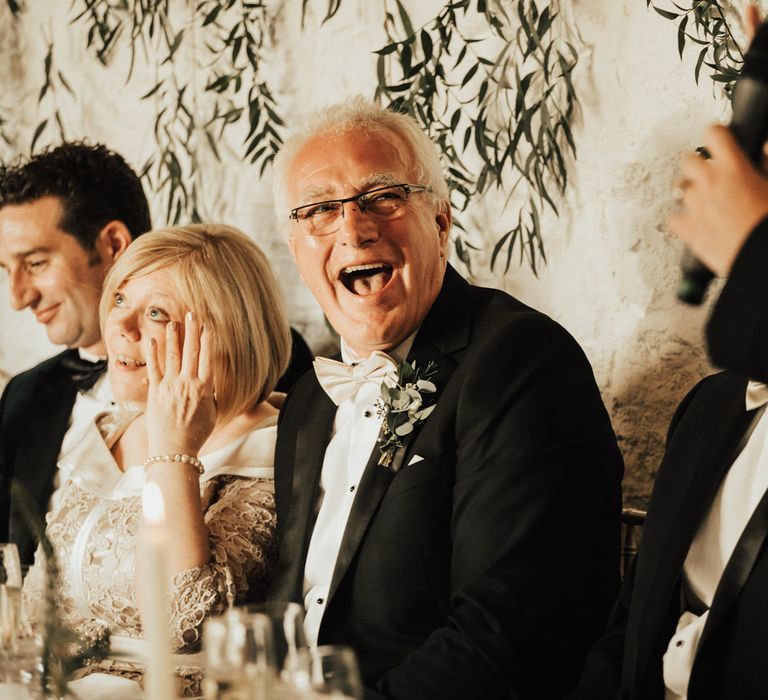 Wedding guests enjoy the wedding speeches at Askham Hall wedding