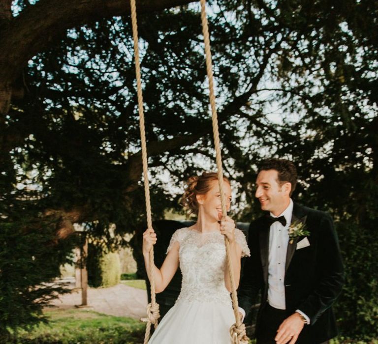 Bride &amp; groom enjoy the grounds of Askham Hall