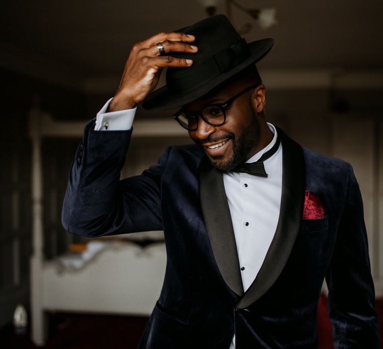 Stylish groom in Fedora hat