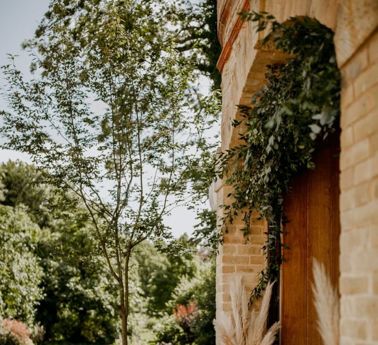 Pampas grass stems decorating the entrance