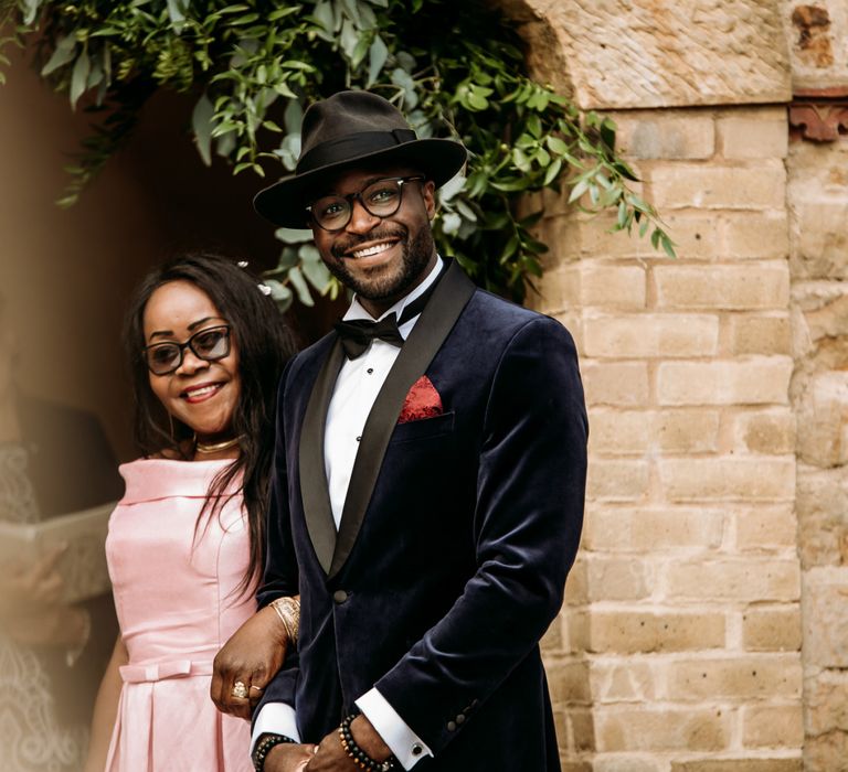 Stylish groom at the altar of The Ravenswood wedding ceremony