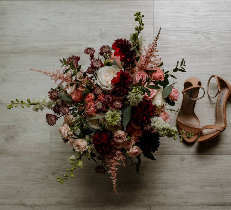 Pink and red flower wedding bouquet and bridal shoes