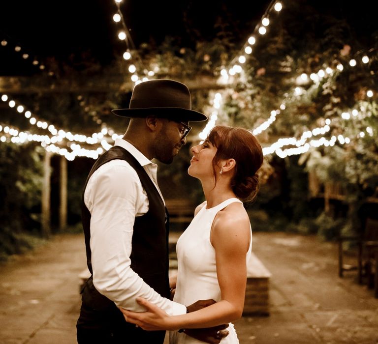 Bride and groom portrait at The Ravenswood with festoon lighting