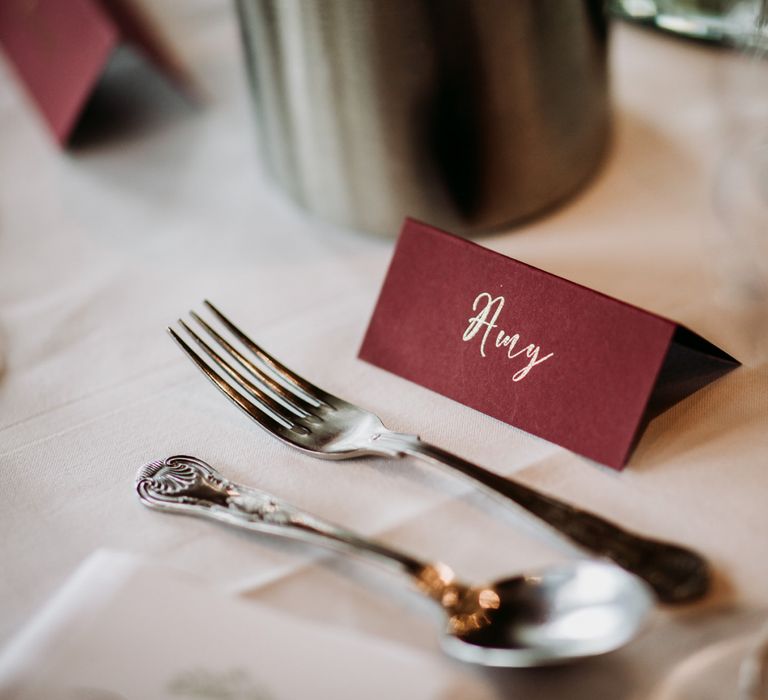 Burgundy name place card with gold font