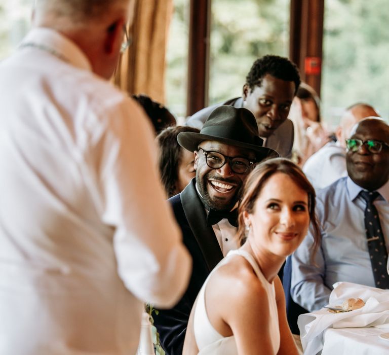 Groom smiling during the wedding speeches