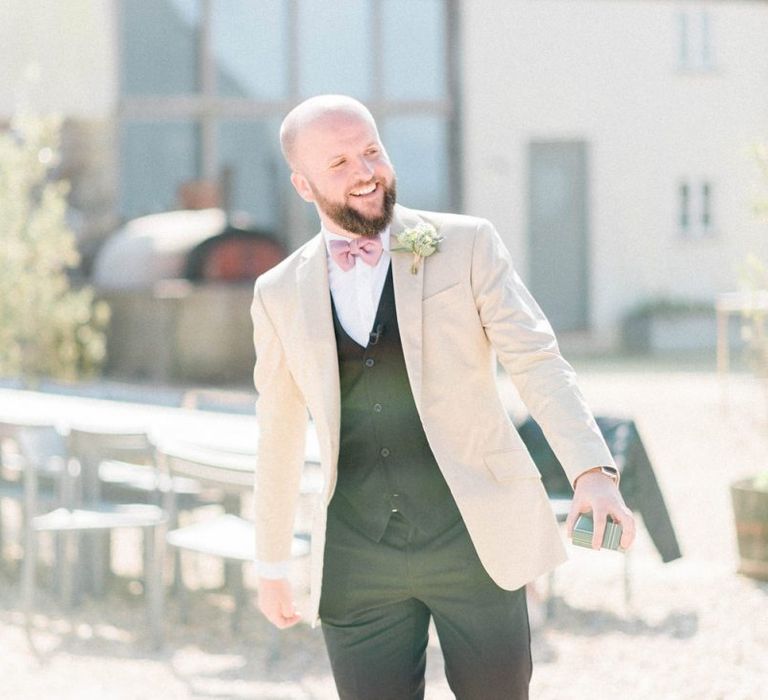 Groom in Black Chino's and Beige Blazer with Bow Tie and Tan Loafers