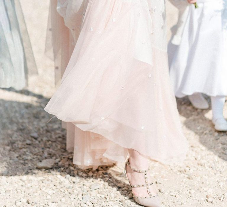 Bride in Pink Ombre Needle &amp; Thread Wedding Dress Holding Up Her Tulle Skirt To Reveal Her Valentino Rock Stud Shoes