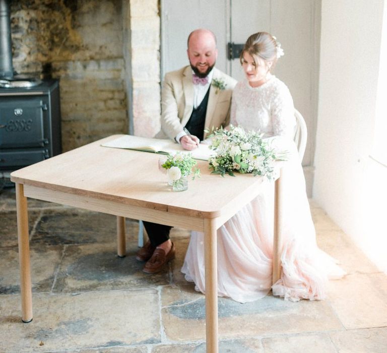 Bride and Groom Signing the Register