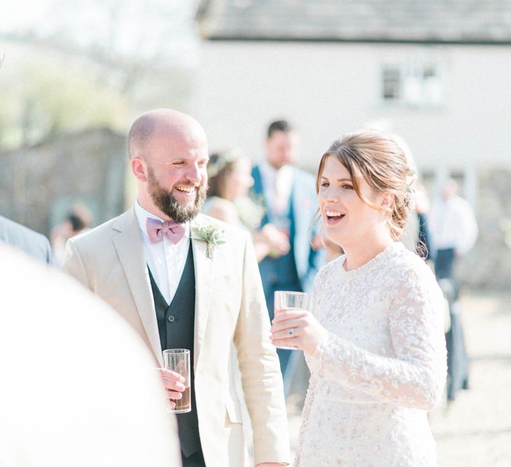 Bride and Groom Talking to Wedding Guests at the Drinks Reception