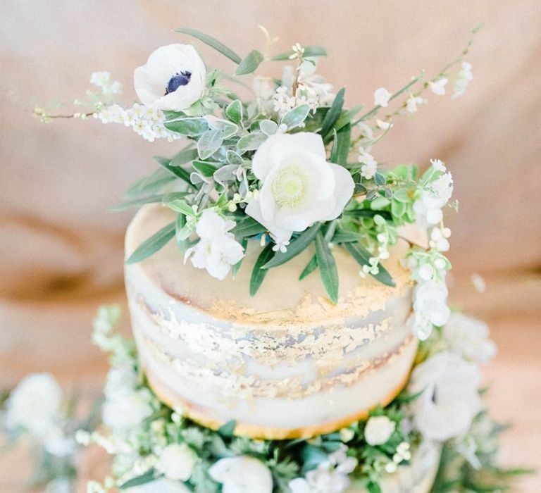 Semi Naked Wedding Cake Decorated with White and Green Flowers